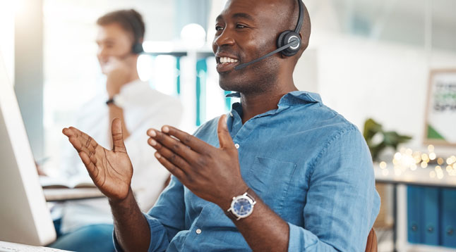 agent on phone with customer using friendly tone from sentiment analysis software data