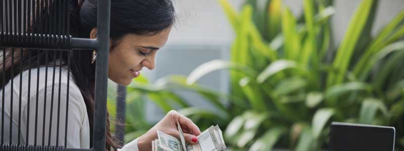 young woman counting money